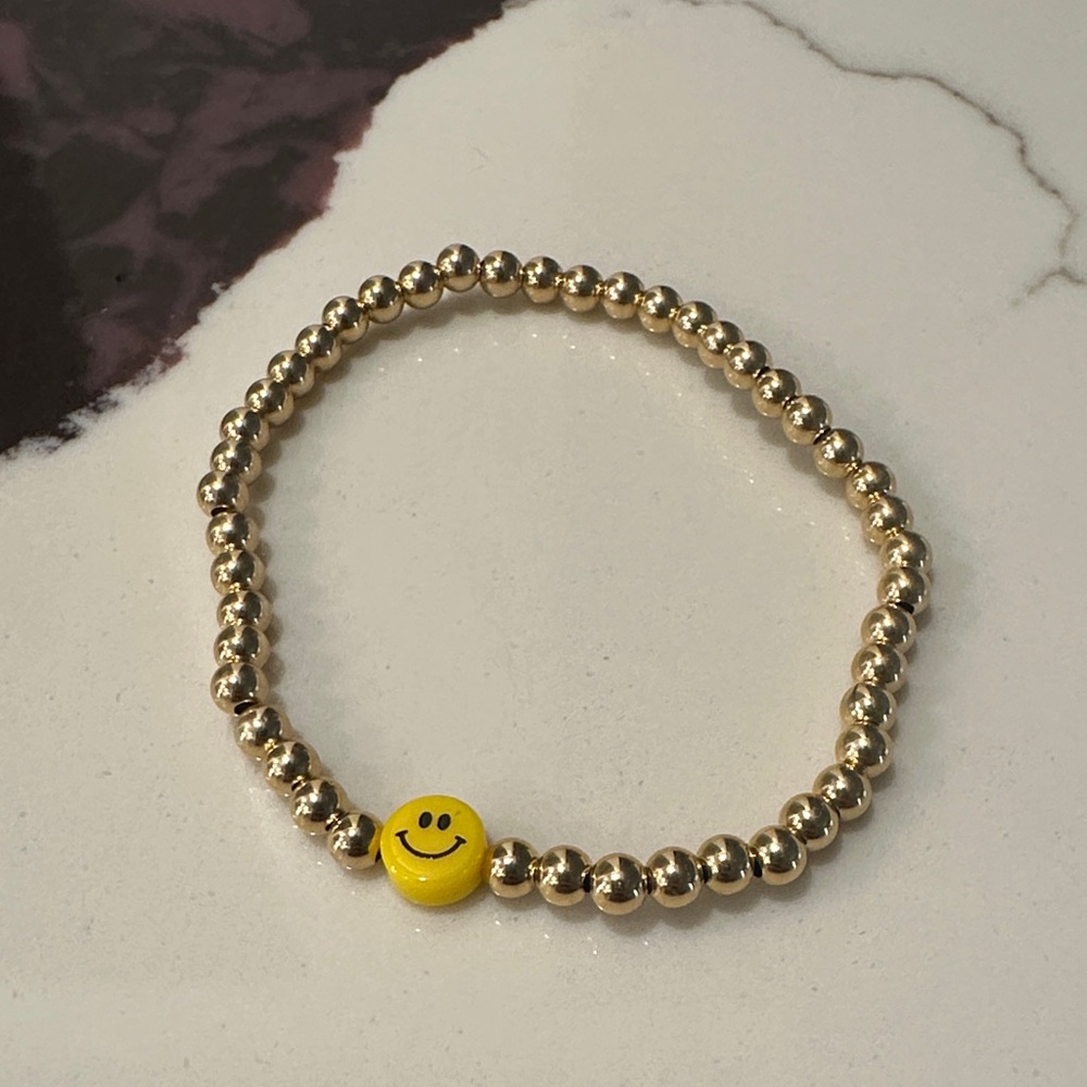 Gold Beaded Bracelet with Yellow Smiley Charm